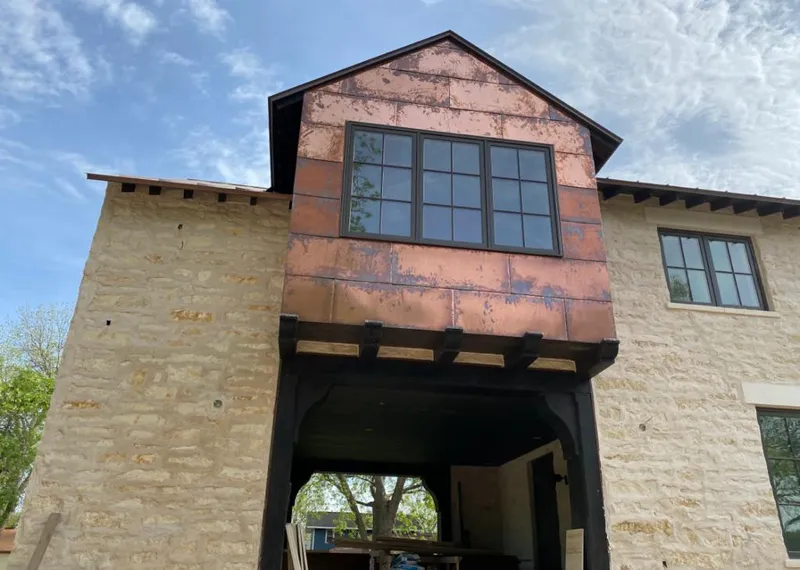 Copper metal panel facade on a stone building for Metal Roof Coating in West Brandywine