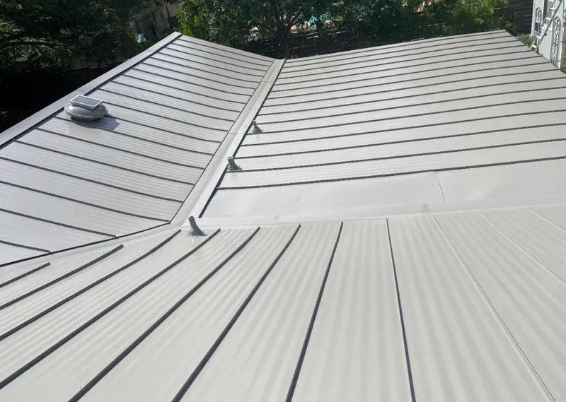 Solar attic fan installed on a metal roof for Roof Ventilation in West Brandywine